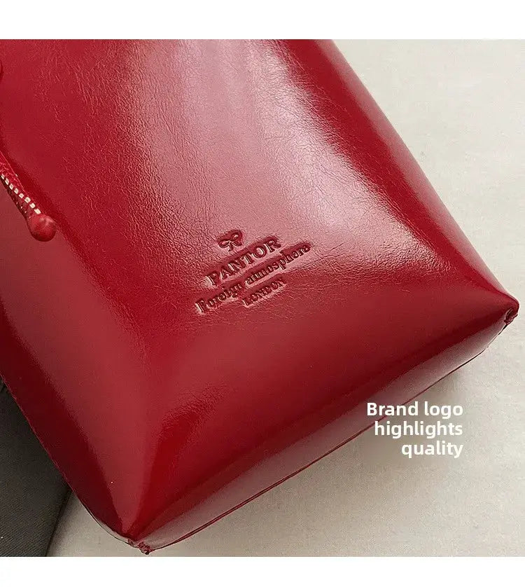 Red glossy PU leather mini crossbody bag with embossed logo detail