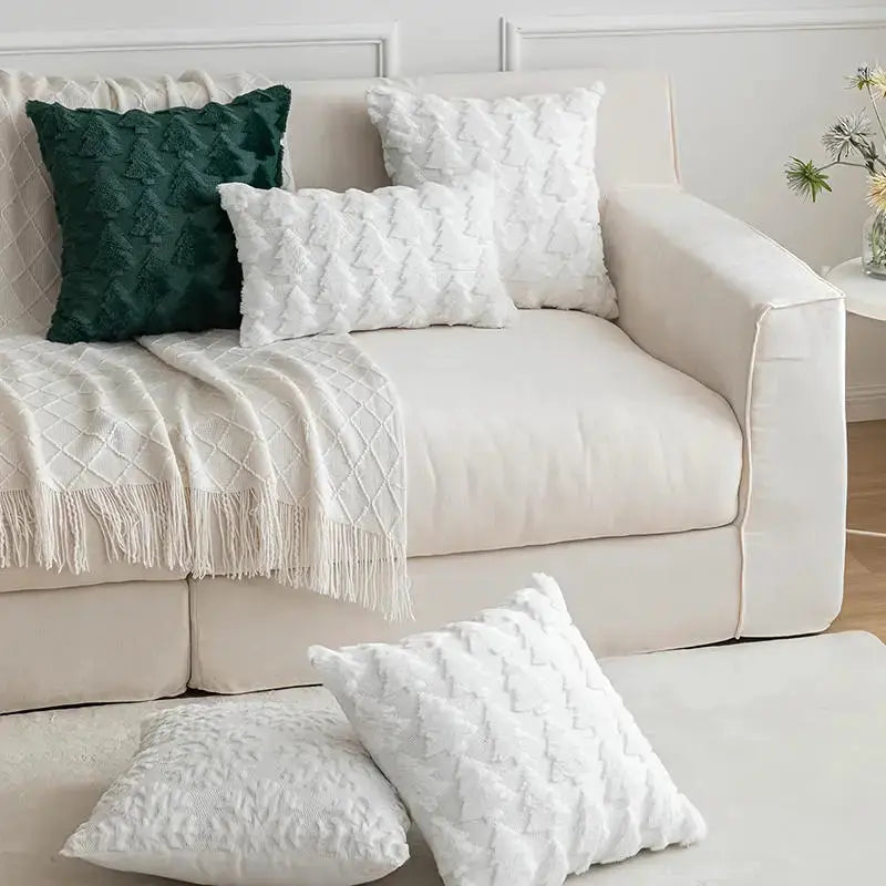 Simples Market Christmas pillow covers; quilted cushions on beige sofa with a dark green accent cushion.
