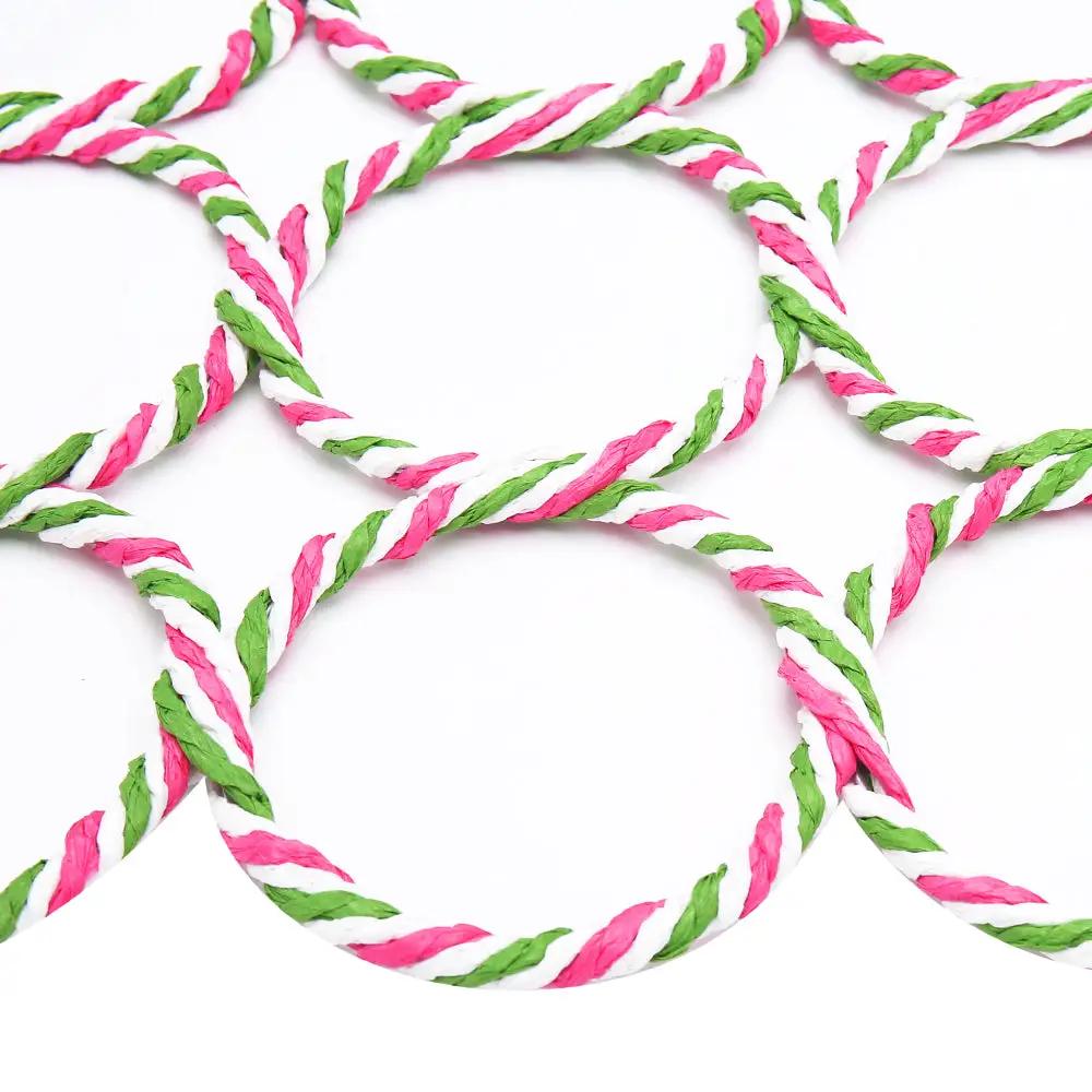 Scarf holder loops made of colorful braided rope in pink, white and green