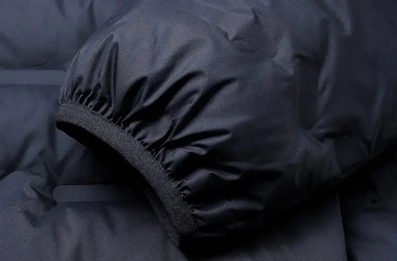 Men's black down puffer jacket cuff with elastic wrist hem in dark fabric