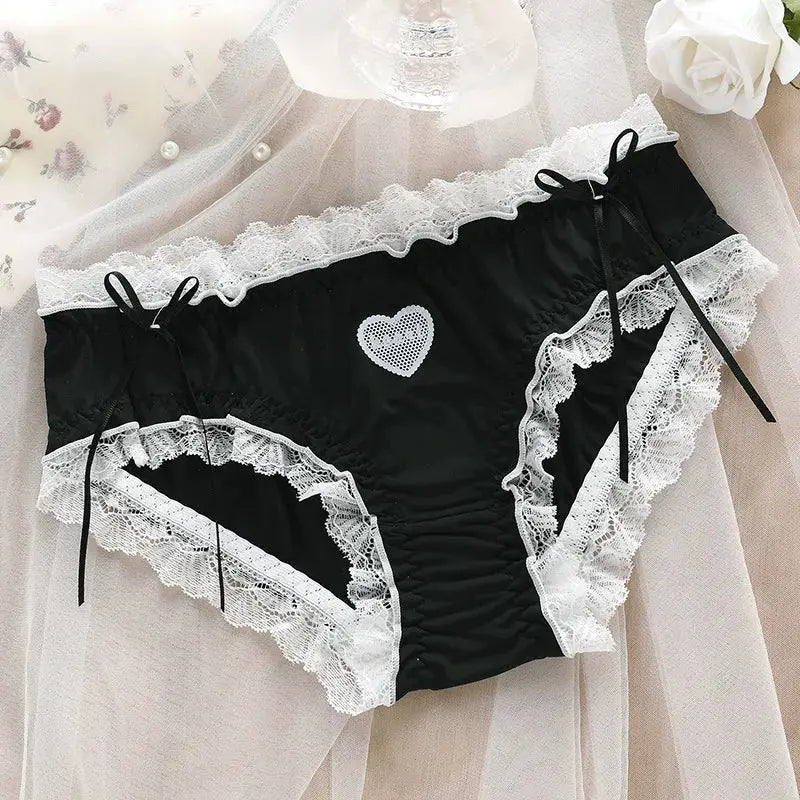 Panties, black satin with white lace trim, heart applique, and bow accents