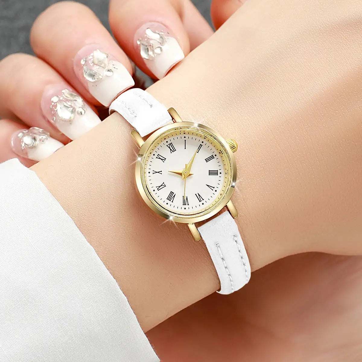 Women's watch with white leather strap, gold-tone case, Roman numeral dial