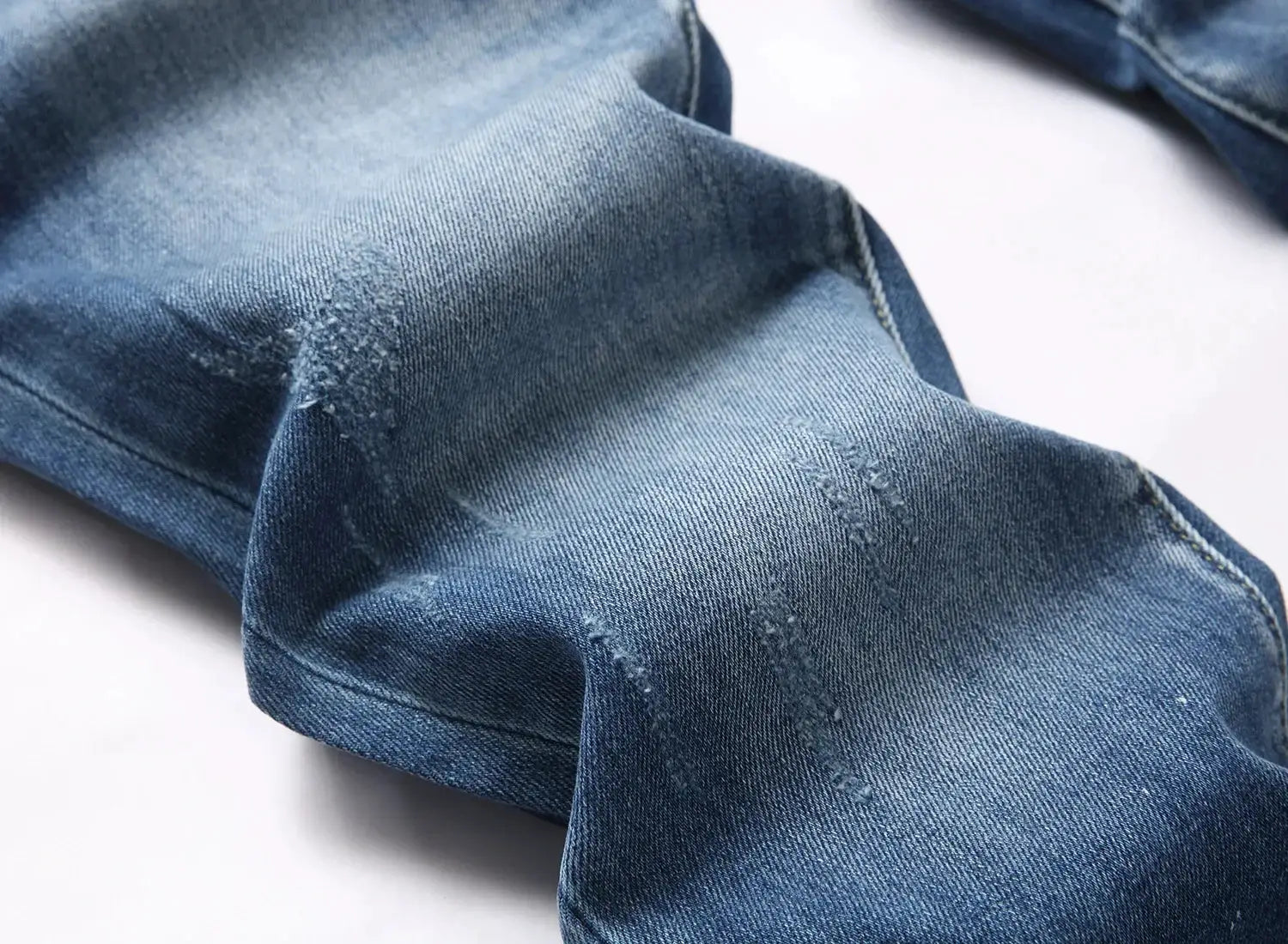 Men's light-blue ripped jeans with distressed holes, Simples Market