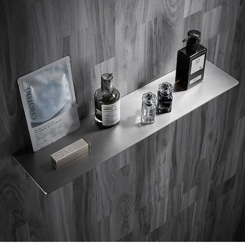 Simples Market 304 stainless steel brushed chrome bathroom corner shelf mounted on tiled wall with bottles.
