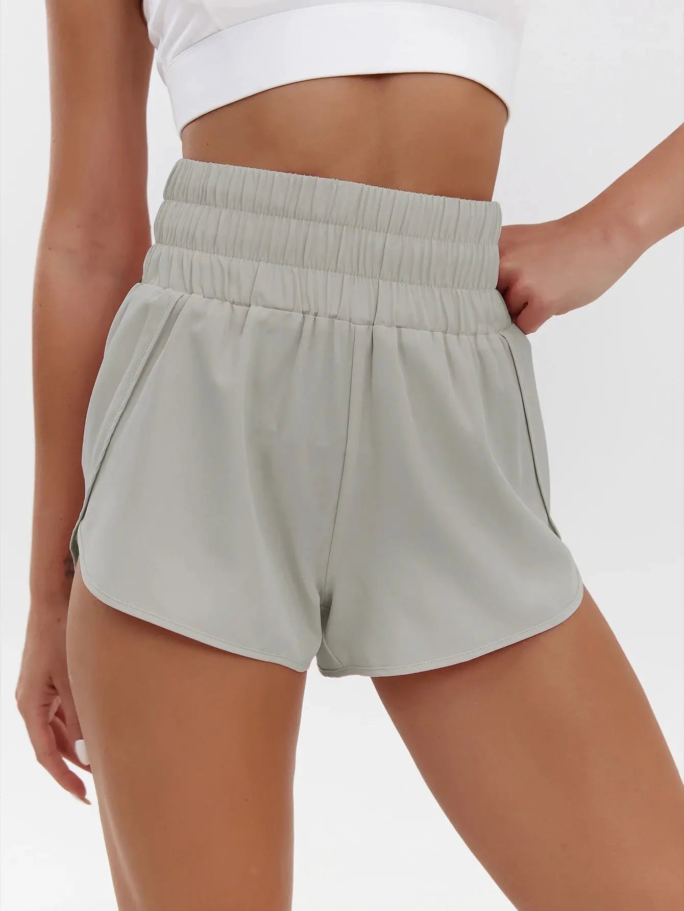 Women's high-waist elastic shorts by Simples Market; light gray, breathable quick-drying sports shorts with side pockets