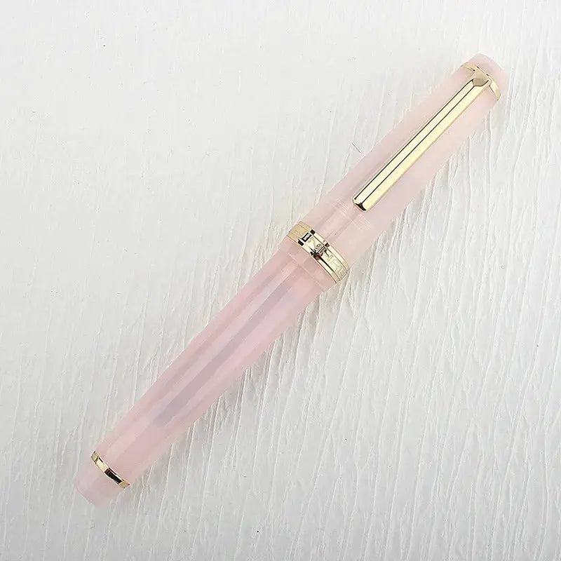 Jinhao 82 fountain pen in pink acrylic with gold trim and clip, converter included