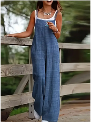 Women's sleeveless denim jumpsuit with suspenders, loose fit, blue, pockets — Simples Market