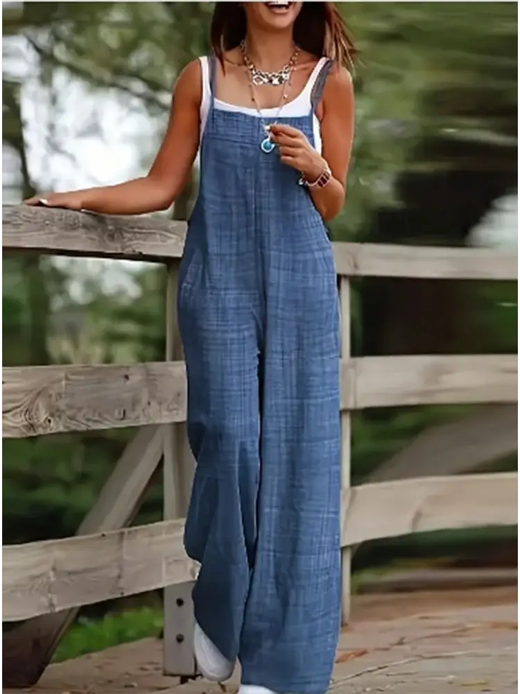 Women's sleeveless denim jumpsuit with suspenders, loose fit, blue, pockets — Simples Market