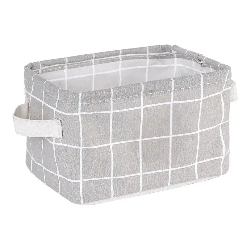 Linen desktop storage basket in gray with white grid pattern and side handles