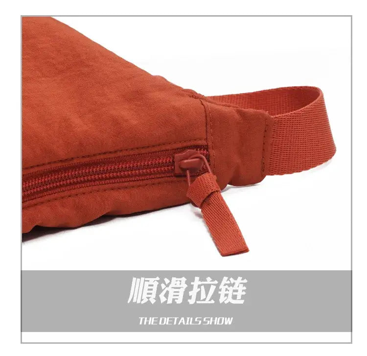 Casual nylon hobo crossbody bag in orange-red with zipper closure and adjustable strap, large capacity tote