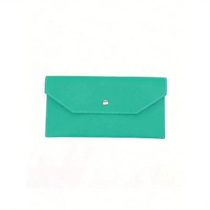 Teal leather wallet with envelope-style flap and snap closure.