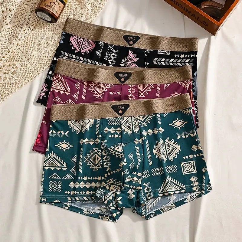 Boxer shorts set of 4 with tribal prints in teal, burgundy, black, and teal-green with tan elastic waistbands