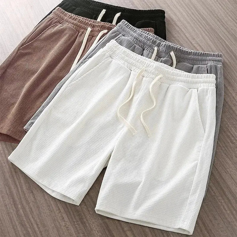 Men's solid-color waffle-textured drawstring shorts, knee-length, mid-waist; five colorways