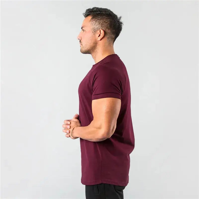 Maroon cotton slim-fit men's short-sleeve gym T-shirt for workouts.