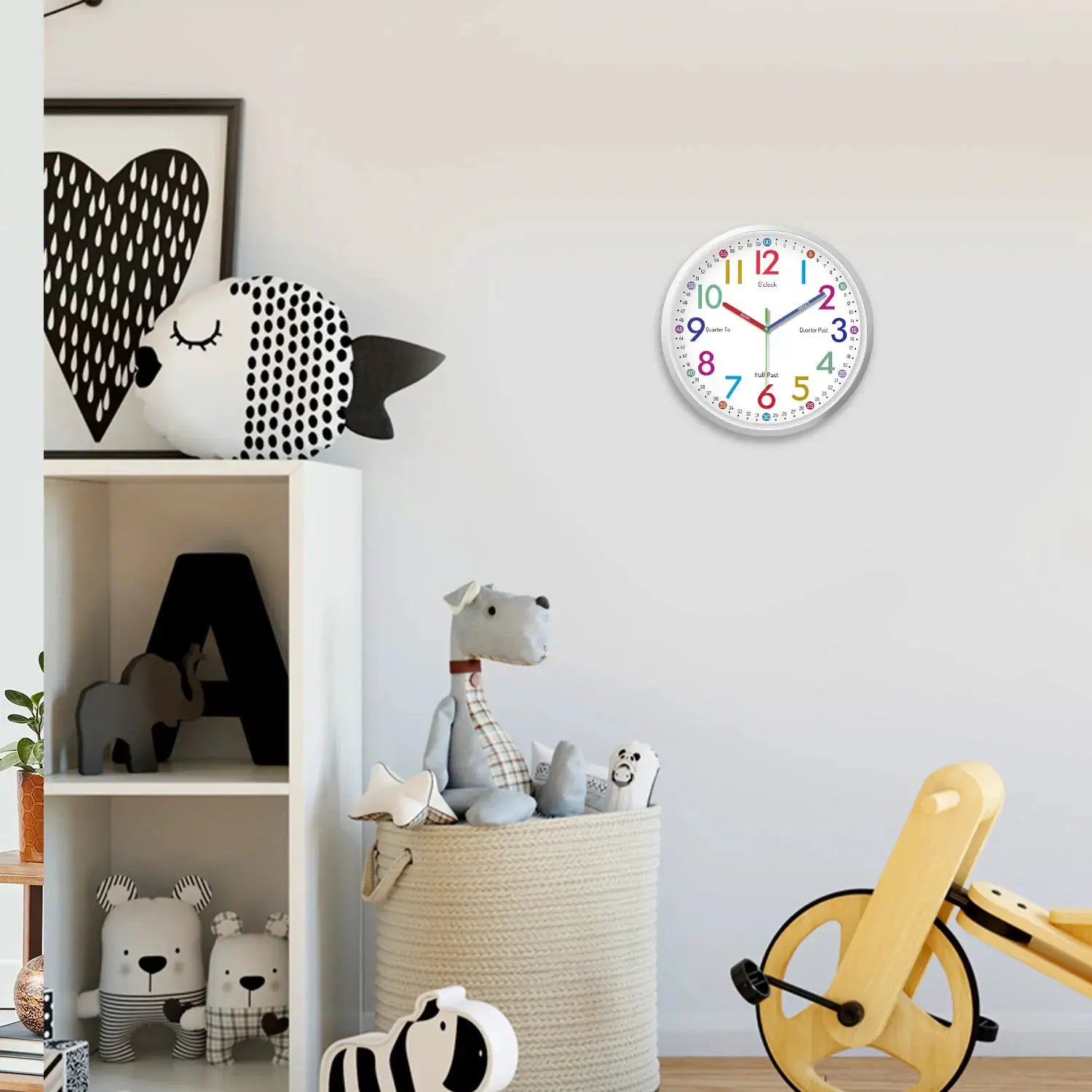8-inch minimalist plastic glass wall clock by Simples Market with colorful numbers in a bright kids’ room.