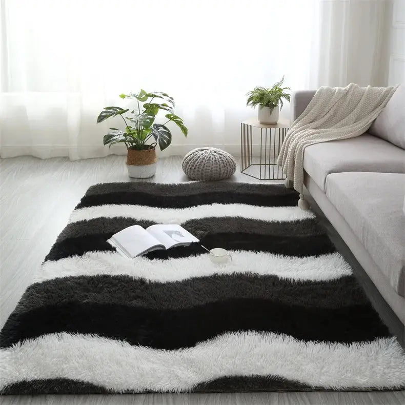 Fluffy striped shag rug for living room, black and white plush surface.