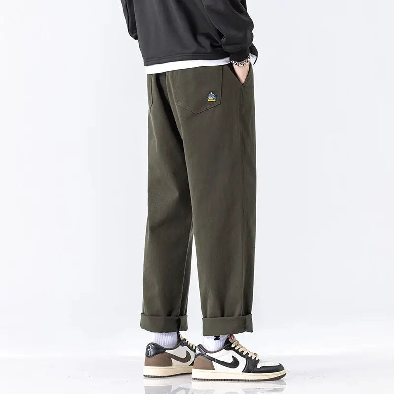 HIQOR men's casual cargo jogger pants in olive green cotton with rolled cuffs and small embroidered patch on pocket.