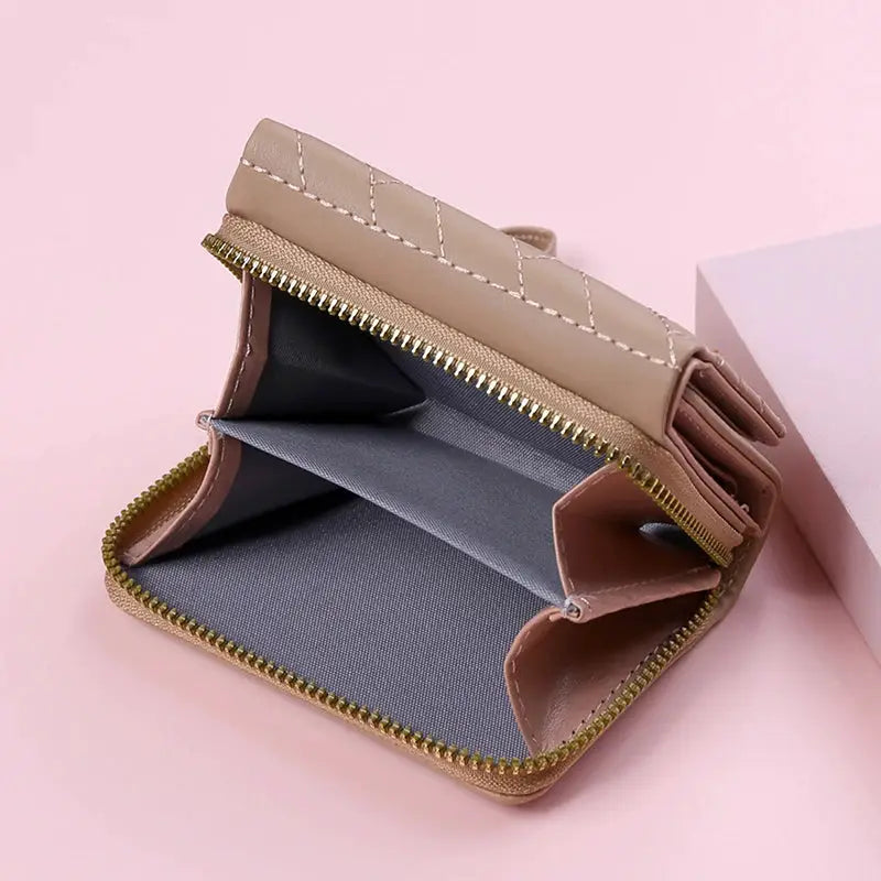 Women's PU leather tri-fold wallet with zipper closure, beige with embroidered love pattern and multiple card slots