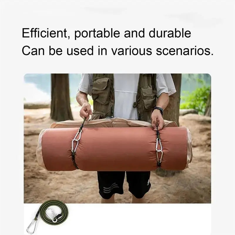 Pair of green heavy-duty bungee cords with metal carabiner hooks securing a rolled camping mat