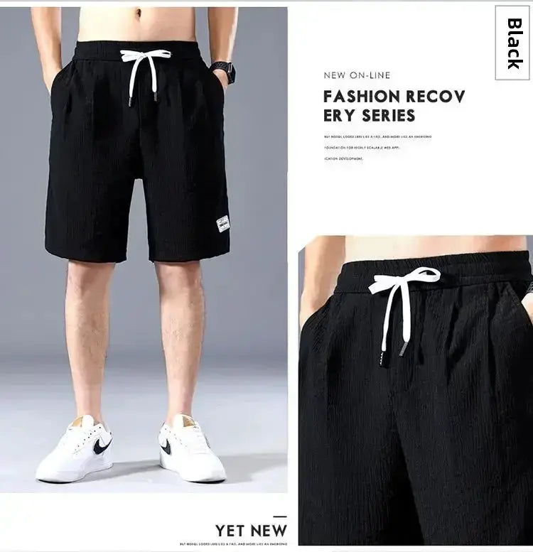 Men's black ice silk casual shorts with white drawstring, loose fit, knee-length, front view with side pockets.