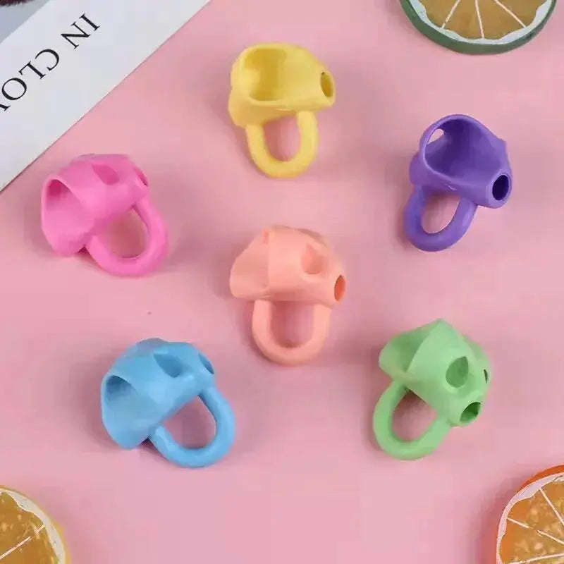 Simples Market six-color three-finger pencil grips; silicone writing aids for primary students, 6-pack.