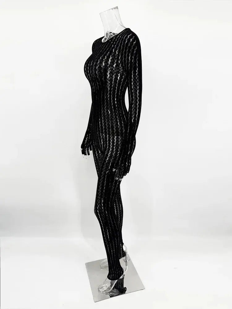 Simples Market Tossy see-through black jumpsuit with long sleeves on a mannequin