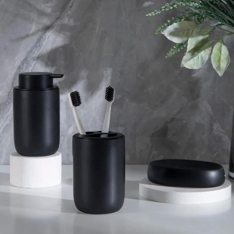 Black ceramic bathroom set by Simples Market; 3-piece with soap dispenser, toothbrush holder, and soap dish.