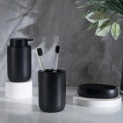 Bathroom set in matte black ceramic: pump bottle, toothbrush holder with two brushes, soap dish (3-piece)
