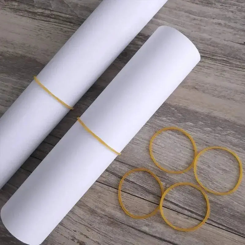 Yellow rubber bands set, 38mm diameter, natural rubber with high elasticity; shows two white paper rolls and several bands