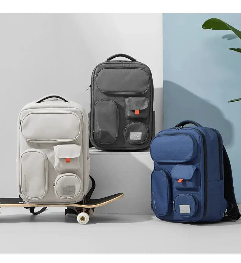 Three Mixi outdoor backpacks by Simples Market in white, gray and blue; 18-inch waterproof travel rucksacks
