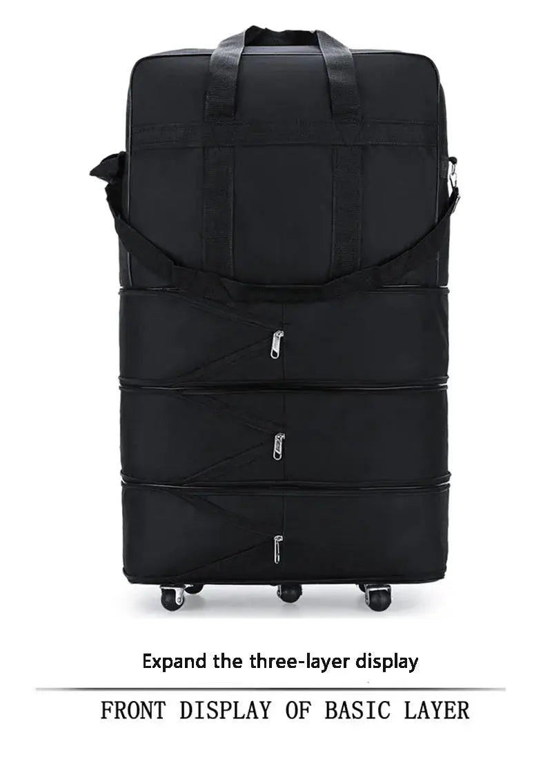 Black expandable rolling suitcase by Simples Market with three-layer design, wheels, and top handles.