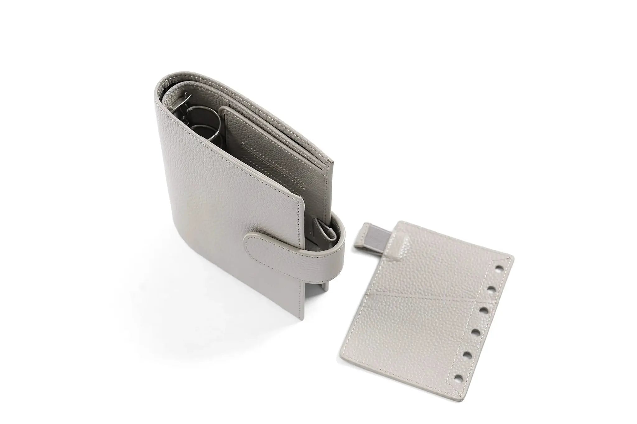 Moterm Luxe 2.0 pocket planner in grey pebble-grain leather with 30mm rings; A7 compact notebook by Simples Market