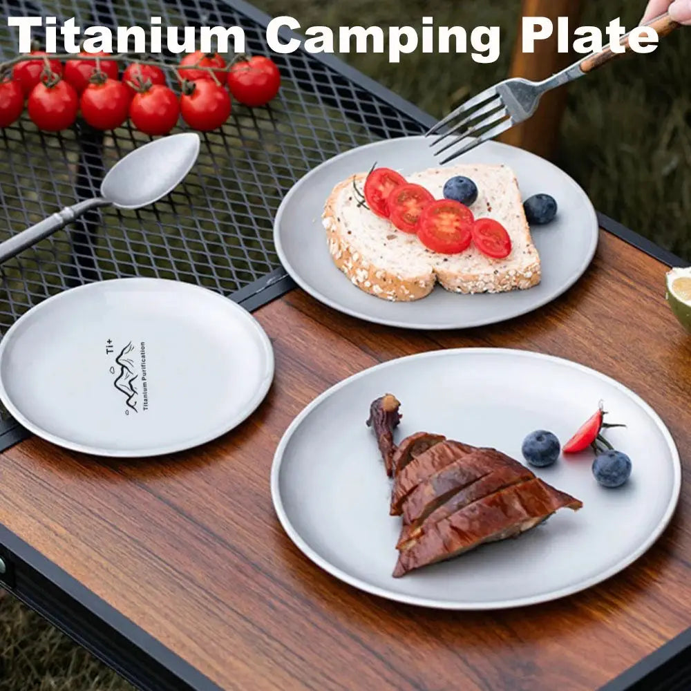Three titanium camping plates by Simples Market, frosted round reusable tableware for outdoor dining.