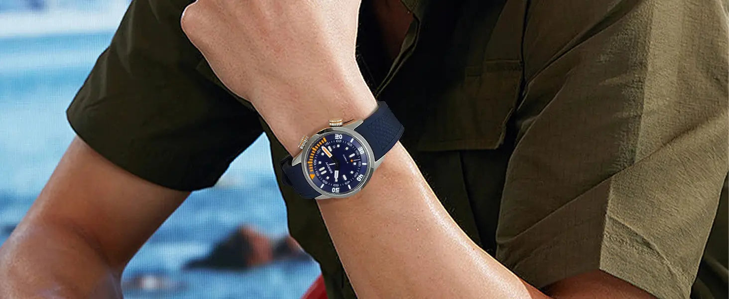 BERNY automatic dive watch for men with blue dial, orange bezel accents, silver case and navy strap.