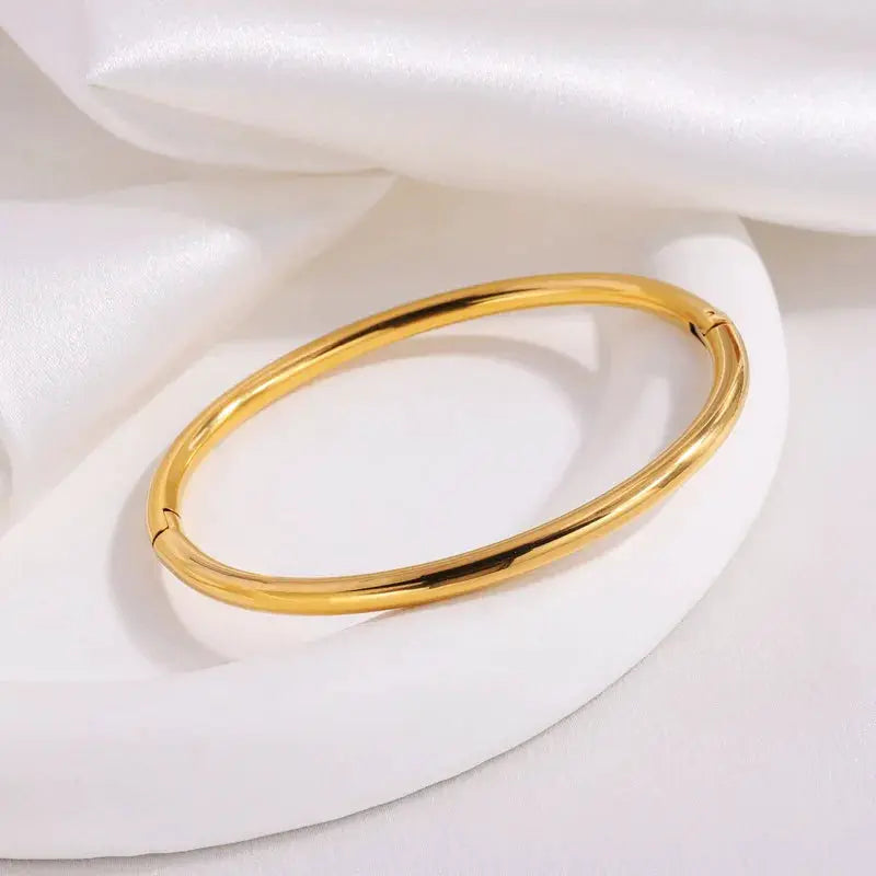 Gold-tone stainless steel openable cuff bracelet for women with a smooth polished finish