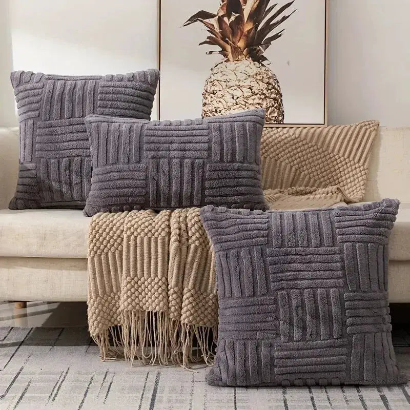 Boho faux fur throw pillow covers in gray on a sofa with a cream beige knit blanket