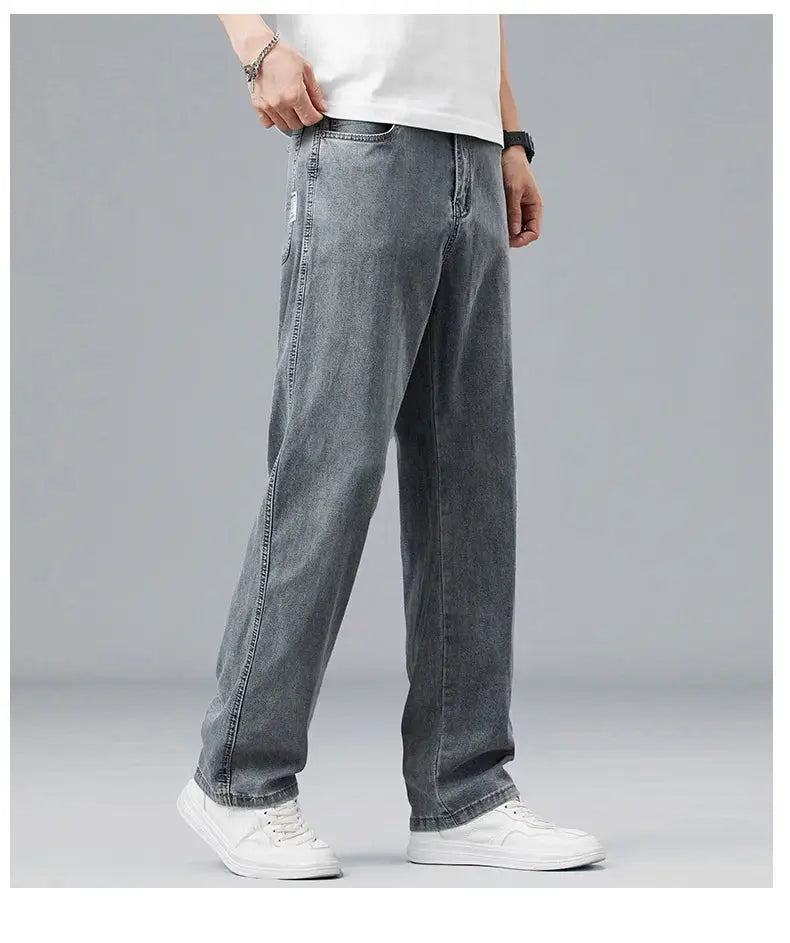 Simples Market Summer ultra-thin lyocell men's jeans, loose straight fit in light gray denim worn with white sneakers