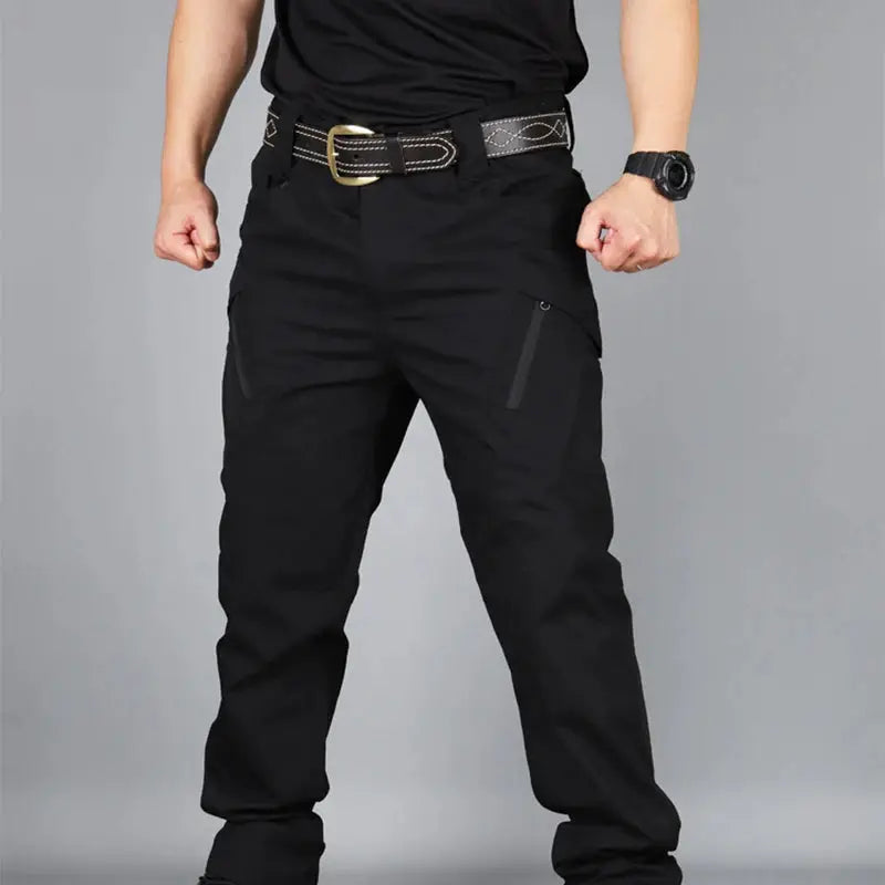 Men's black tactical cargo pants with multiple pockets and a zippered side pocket
