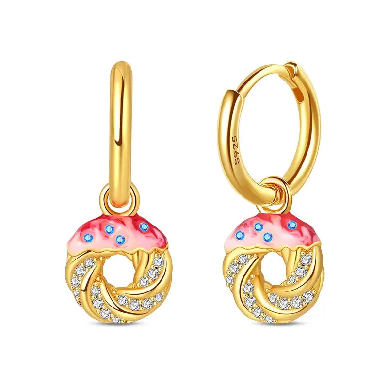 Pair of gold-tone hoop earrings with pink frosted donut charms and crystal pavé accents.