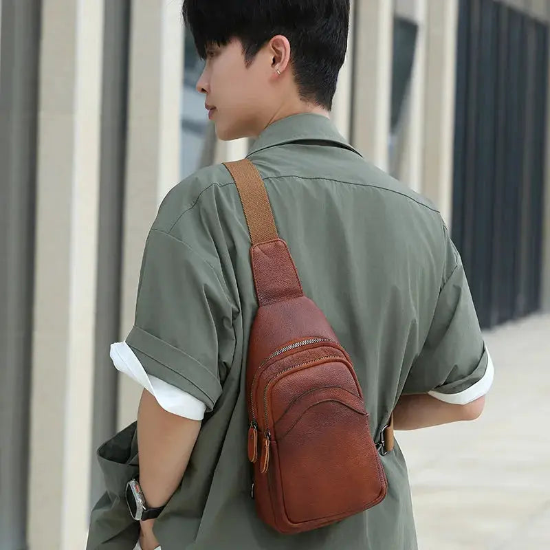 Mens genuine top-grain brown leather chest bag with dual zip pockets and crossbody strap
