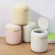 Mini desktop trash can with lid, set of four pastel ribbed plastic bins with gold bands