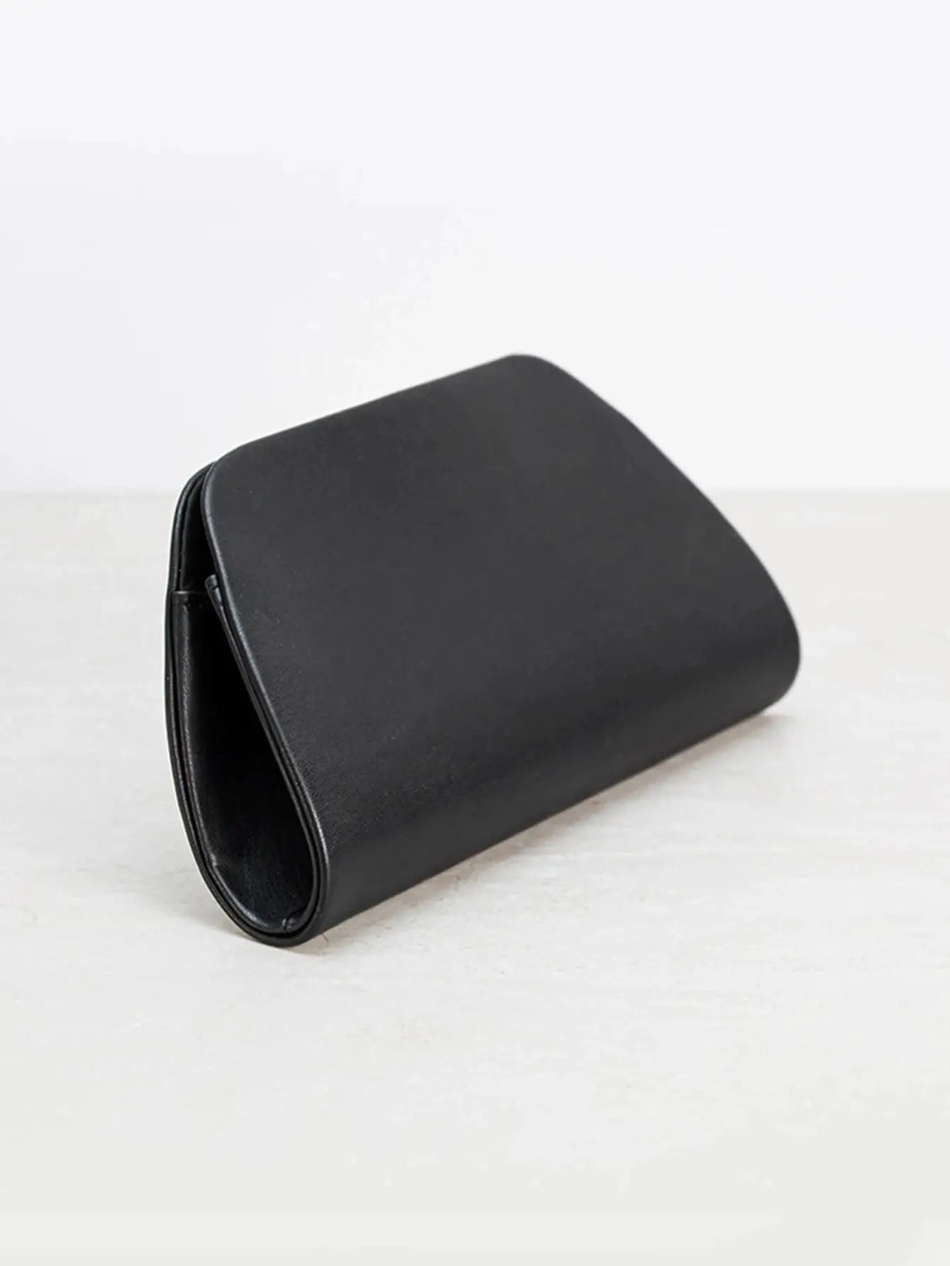 Black box clutch bag with smooth leather finish, sleek evening accessory