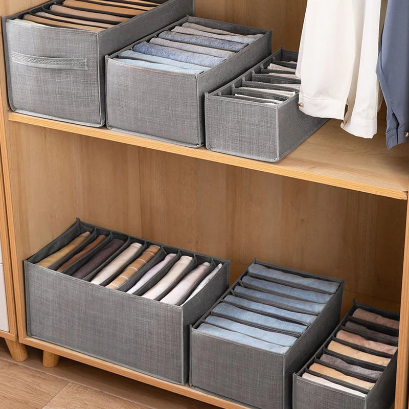 Wardrobe storage boxes, six gray fabric organizers for clothes on a wooden shelf