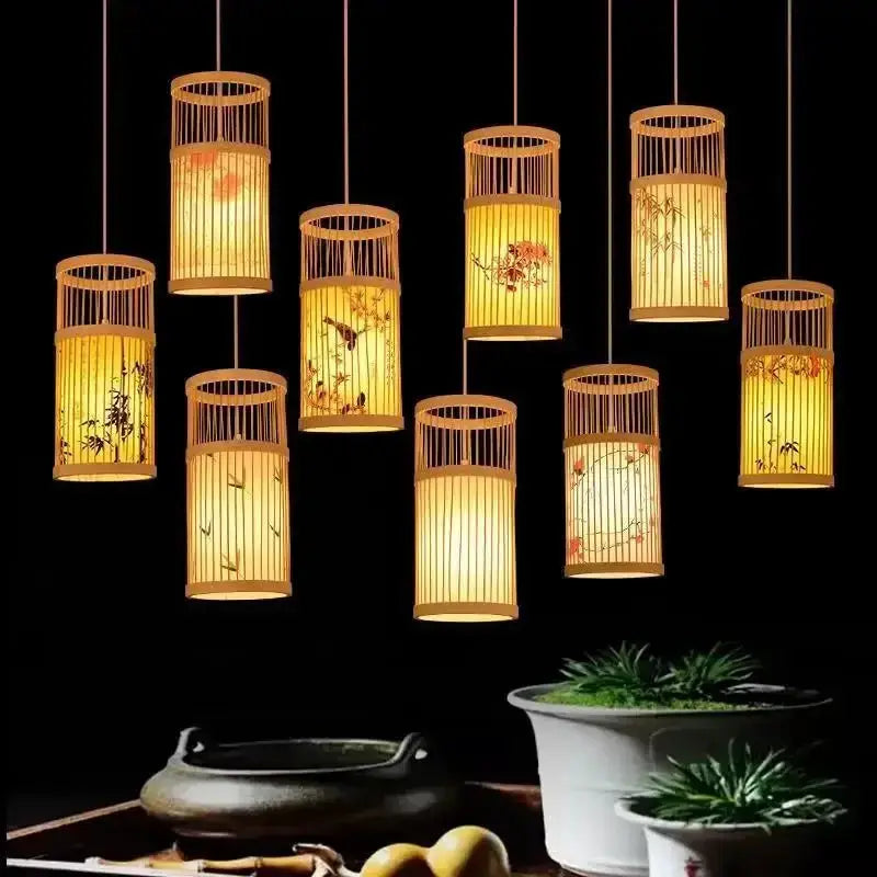 Bamboo lantern chandelier by Simples Market; hanging cylindrical bamboo lamps with warm amber glow for teahouse or restaurant decor