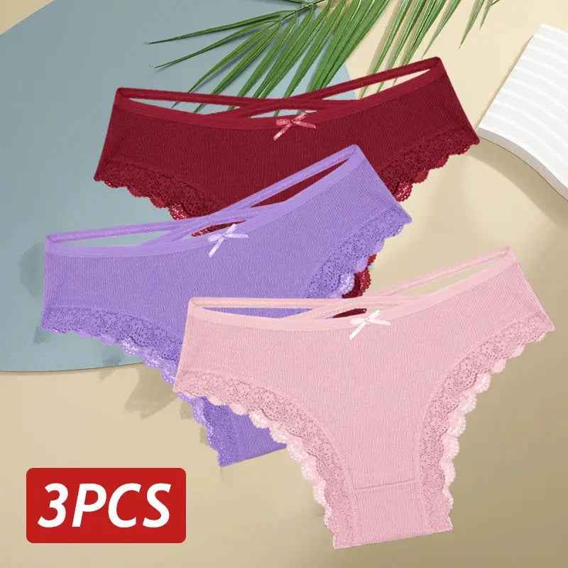 3-piece set of women's cotton lace-trim low-rise panties in red, lavender, and pink with bow accents by Simples Market