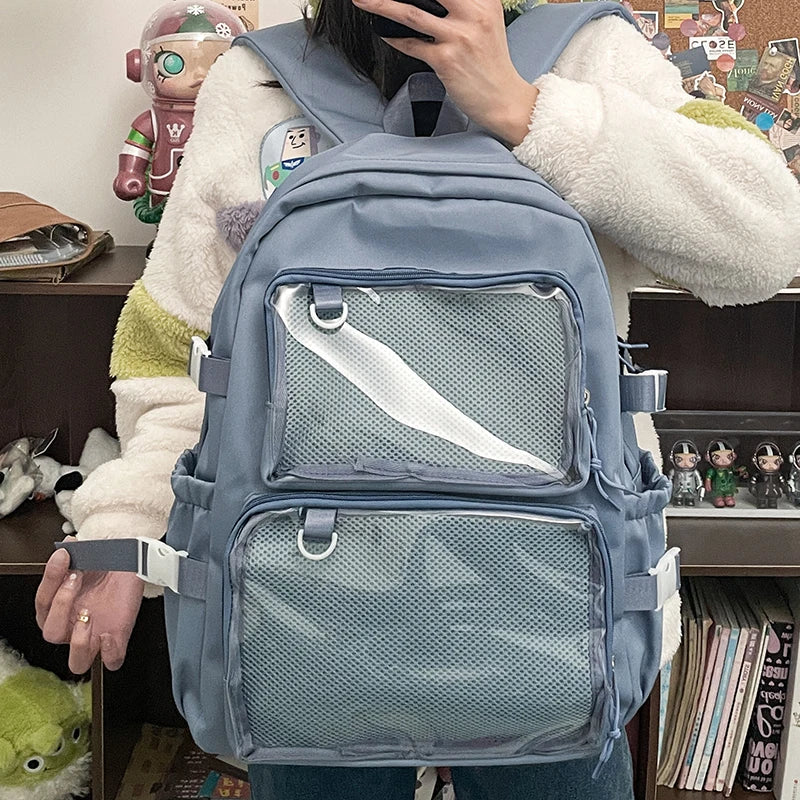 Blue Japanese-style transparent Ita bag by Simples Market; large-capacity mesh-front pockets.