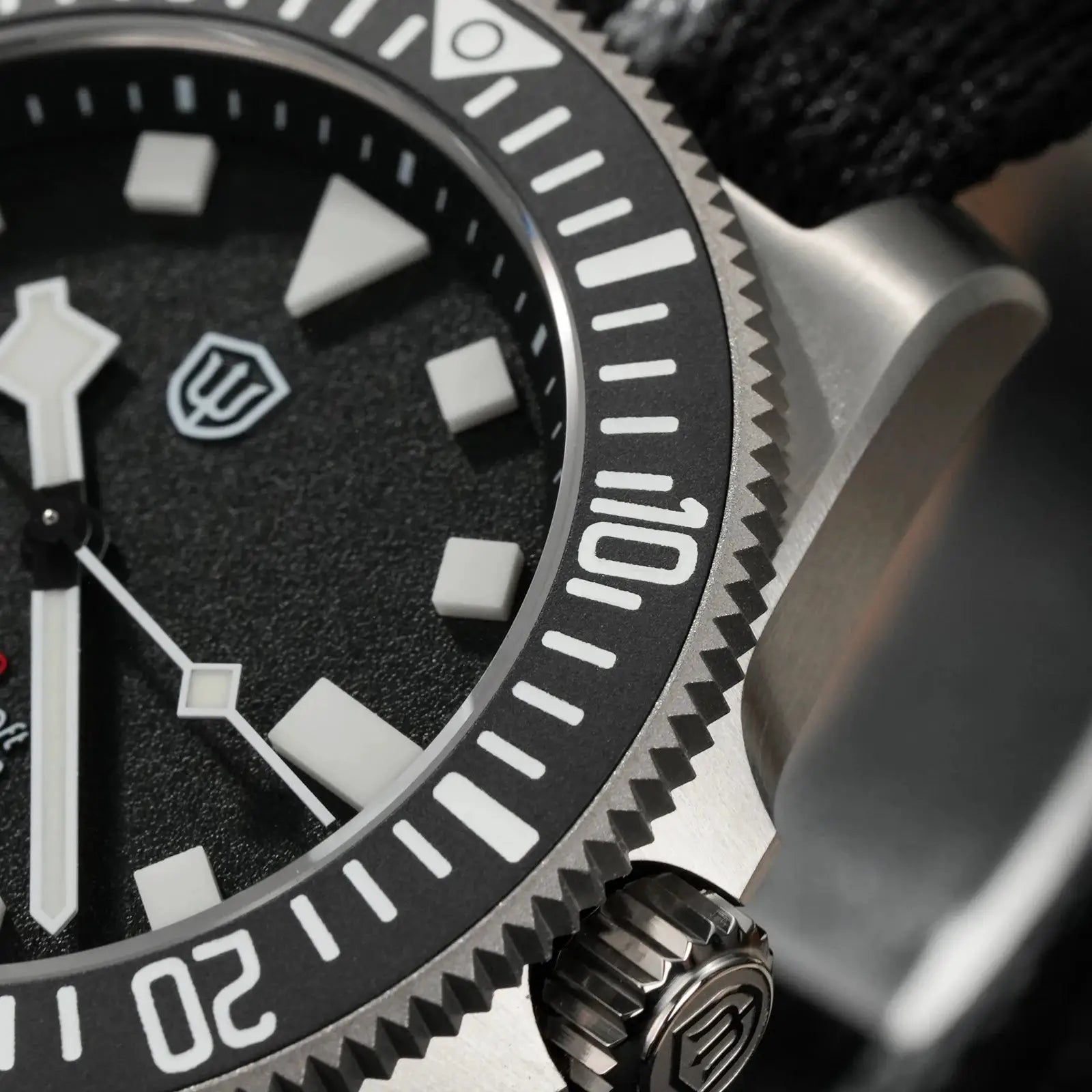 Watchdives EXD 40mm titanium dive watch with black bezel, white markers, crown logo
