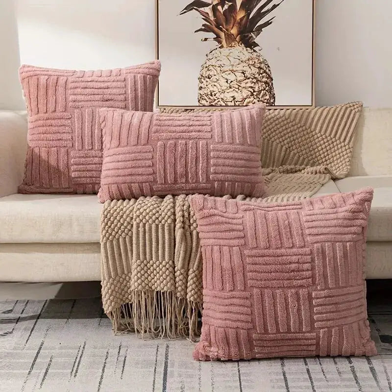Throw pillow covers by Simples Market, pink faux-fur with geometric grid pattern, set of 4 on sofa