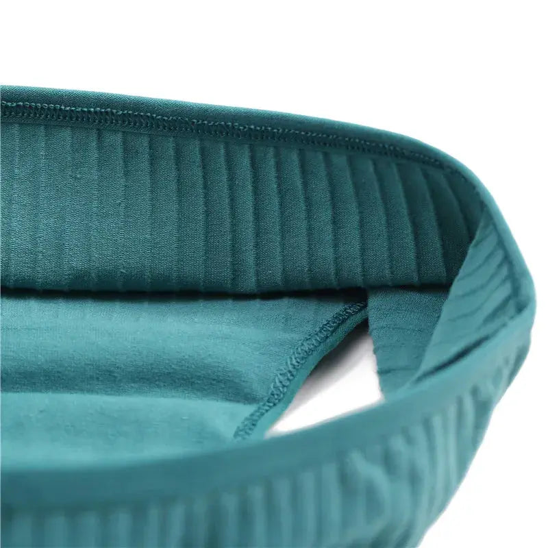 Women's cotton briefs in teal with soft, stretchy fabric and ribbed waistband.