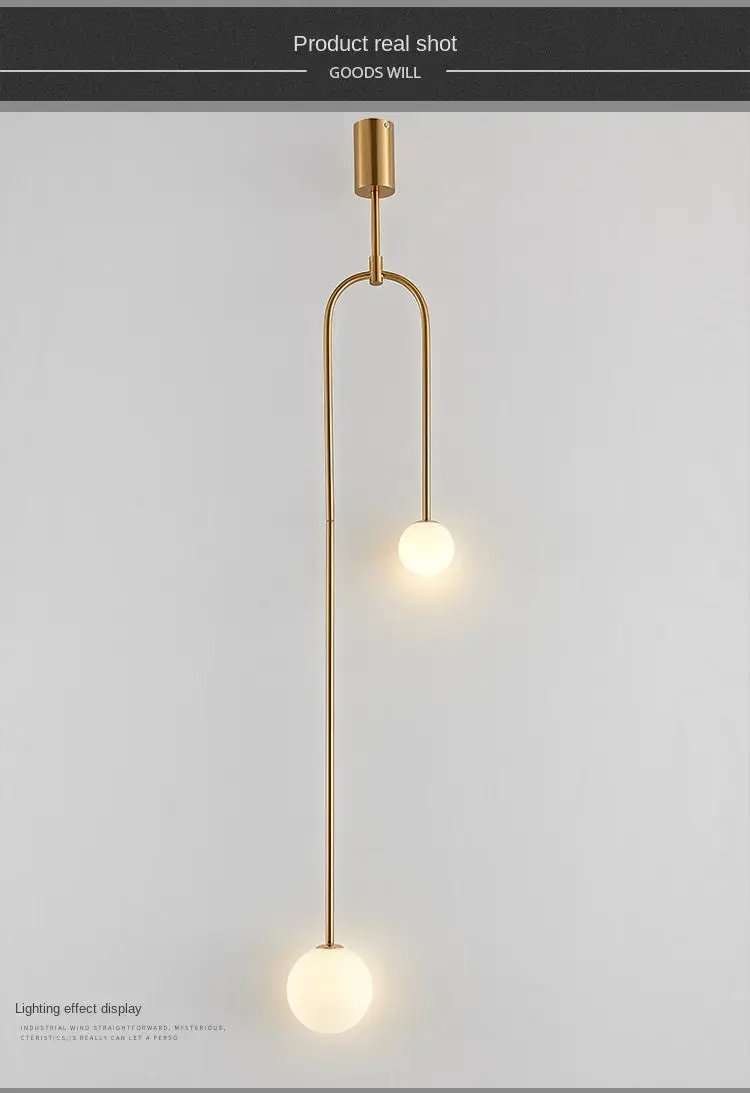 Modern glass ball pendant light by Simples Market in gold with two illuminated glass spheres, LED